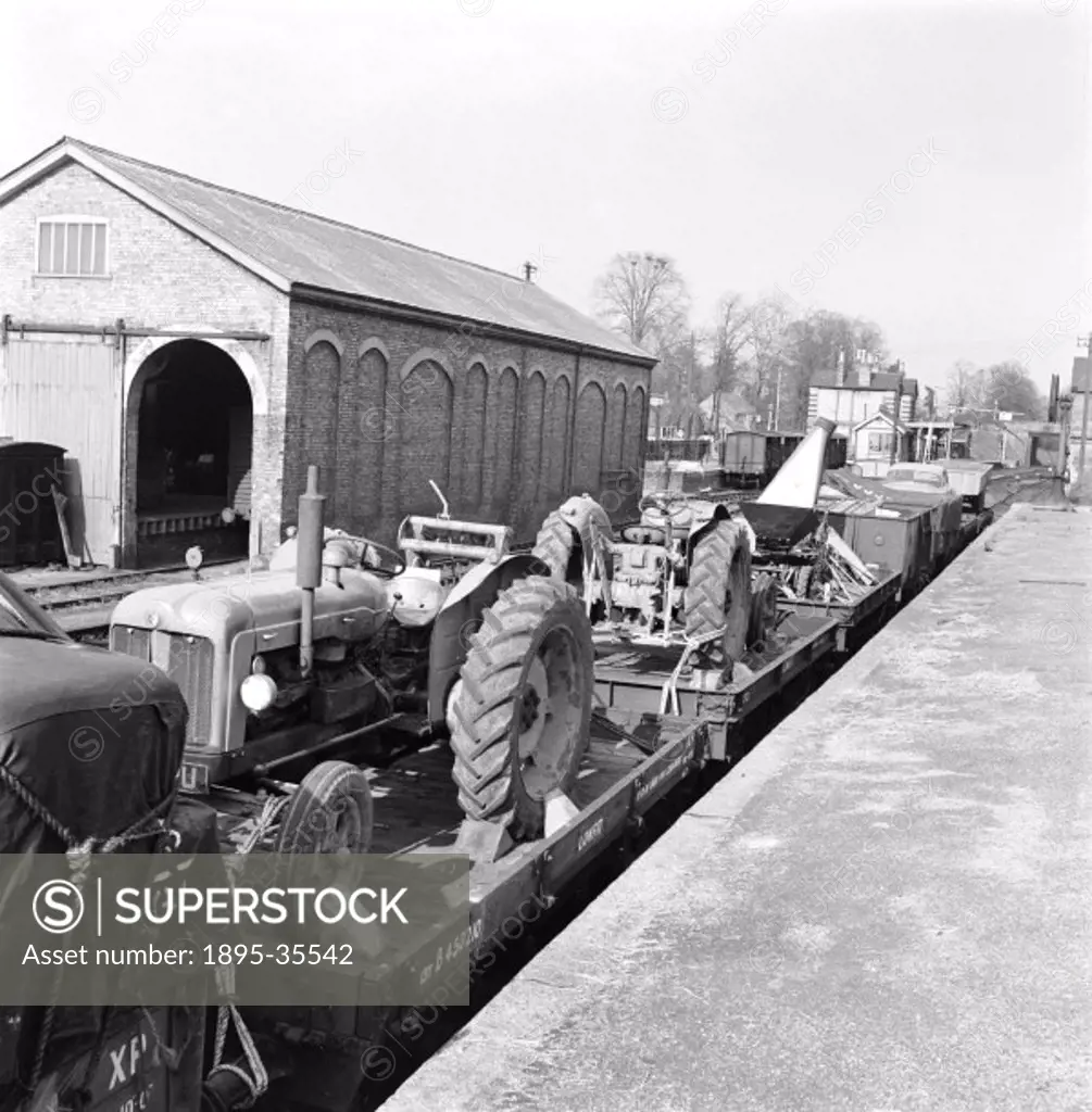 Tractors loaded onto a freight train at Saffron Walden station, 26 April 1961. The tractors are being taken to Bodmin in Cornwall, along with the rest...