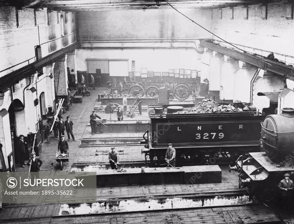 Inside the London & North Western Railway´s King´s Cross locomotive depot, London, 1927.   This depot was where steam locomotives were stored. The eng...