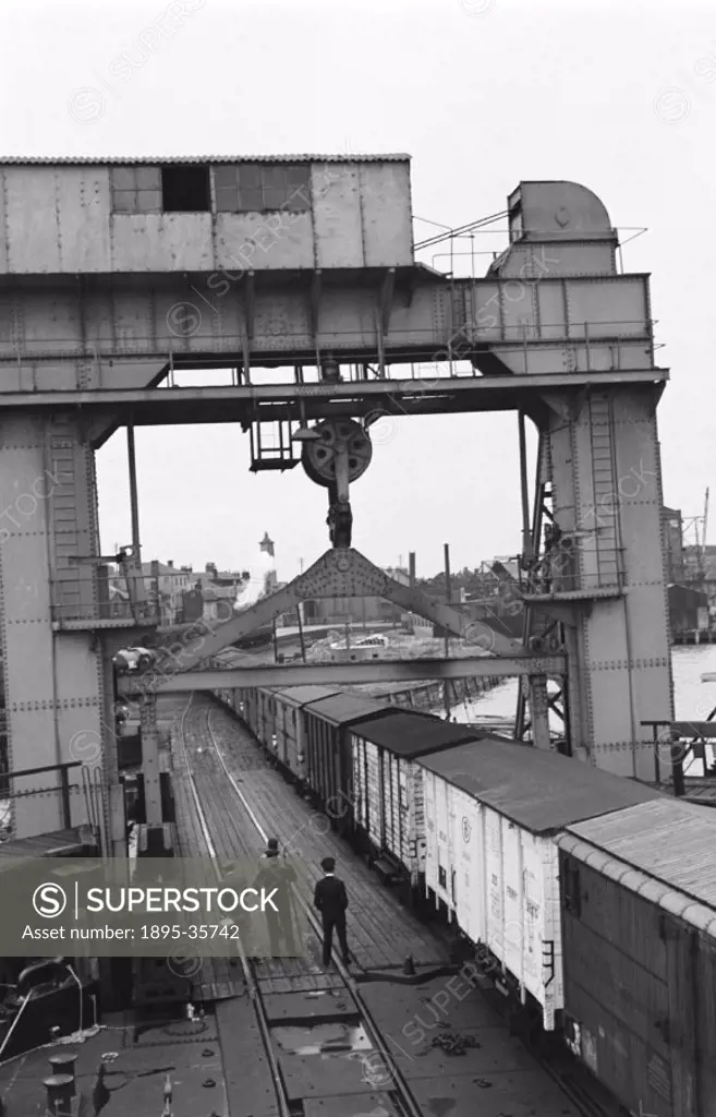 Crane lifting containers onto the ´Norfolk Ferry´ at Harwich, Essex, 17 July 1951. The ship was about to start its maiden voyage.  The ´Norfolk ferry´...