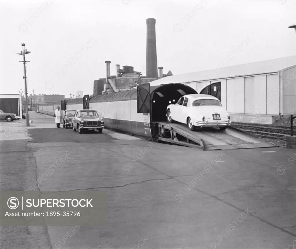 Cars being loaded onto a train at London Caledonian Road station, 18 July 1967.  Motorail services enabled people to take their cars on holiday but st...