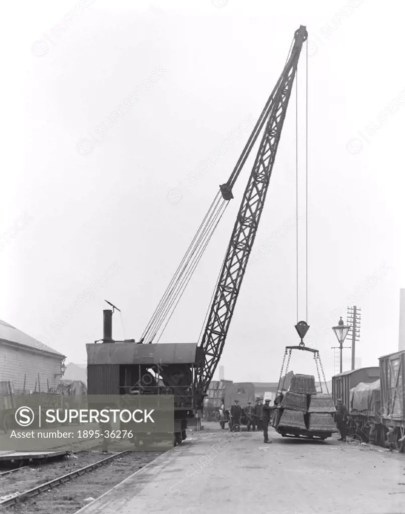 Steam powered crane at Burnley, Lancashire, 17 October 1919.  Cranes are an invaluable machine in railway goods depots to lift heavy loads on and off ...