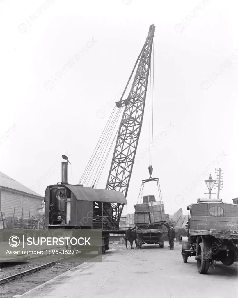 Steam powered crane at Burnley, Lancashire, 17 October 1919.   Cranes are an invaluable machine in railway goods depots to lift heavy loads on and off...