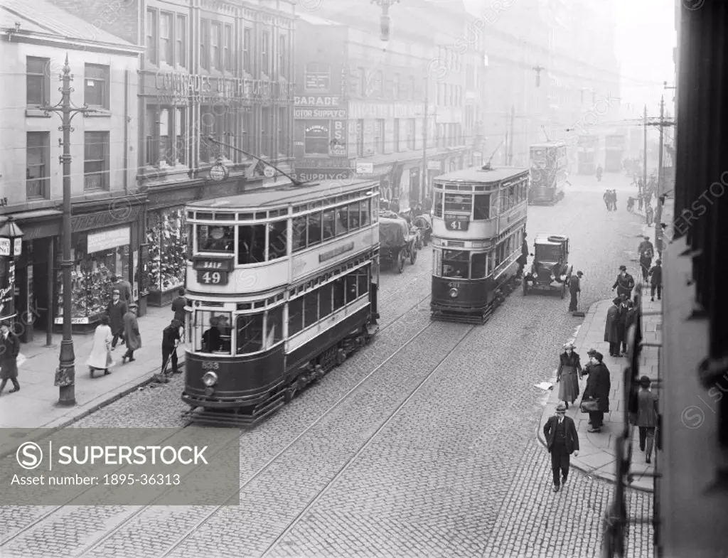 Trams on Oxford Street, Manchester, 15 March 1921.  Trams were first used in Britain in the 1850s in Liverpool. Early trams were pulled by horses alth...