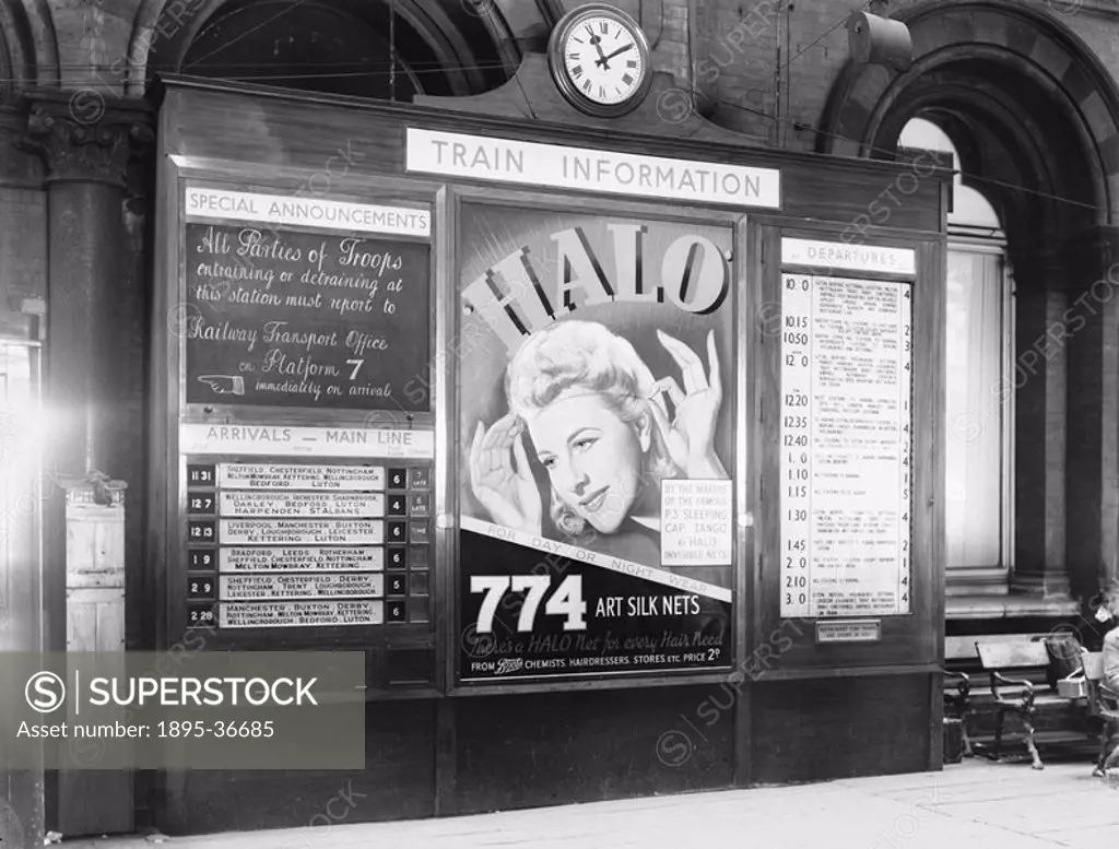Notice board, St Pancras Station, London, Second World War, 1939.The board gives information about arrival and departure times, and information to tro...