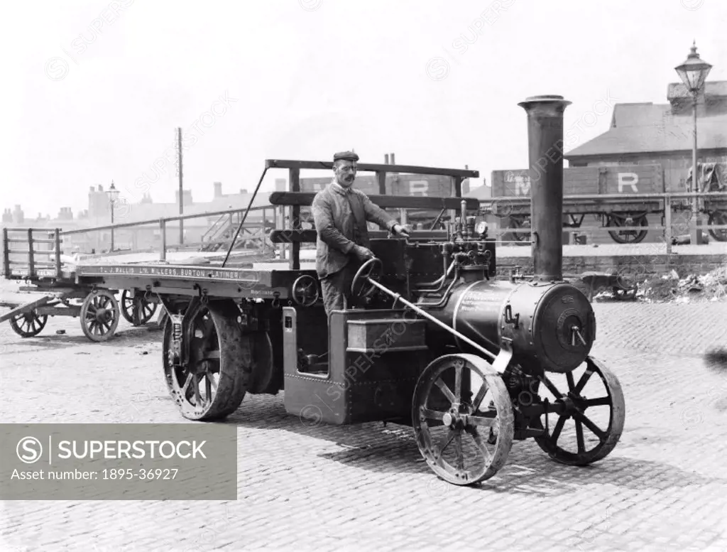 Steam powered lorry at a railway goods depot, about 1900.  Steam powered road vehicles were invented in the 18th century and by the late Victorian per...