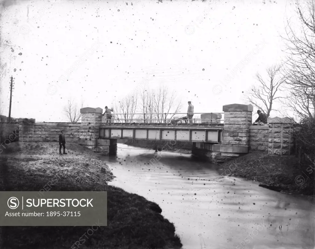 Men working on Brook Bridge, Egginton, Derbyshire, about 1910. This railway bridge has just been rebuilt.  When the railways were first built, trains ...