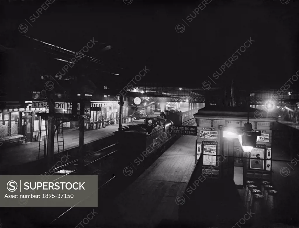 Platforms at Derby station at night, April 1908. This station was on the Midland Railway. It opened in 1840 and had one long platform, so that passeng...