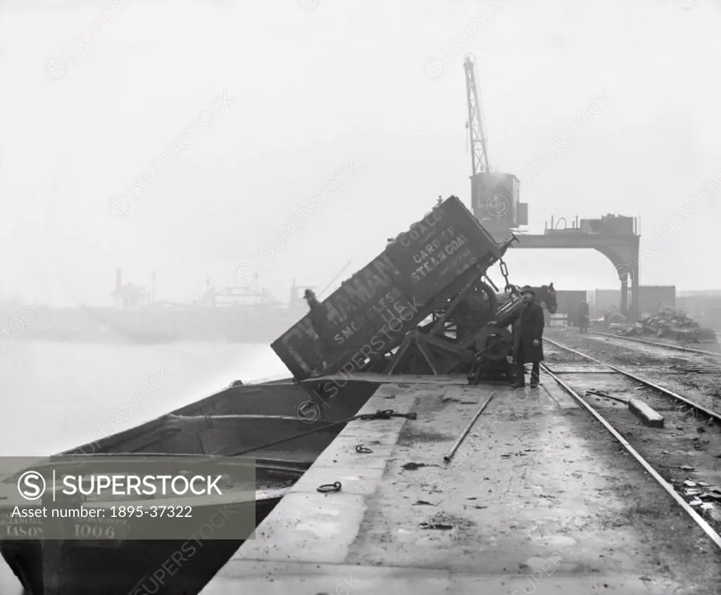 Coal tipper on the Shropshire Union Canal, about 1900.  The canals had declined rapidly when the railways arrived At this time many had closed down. H...