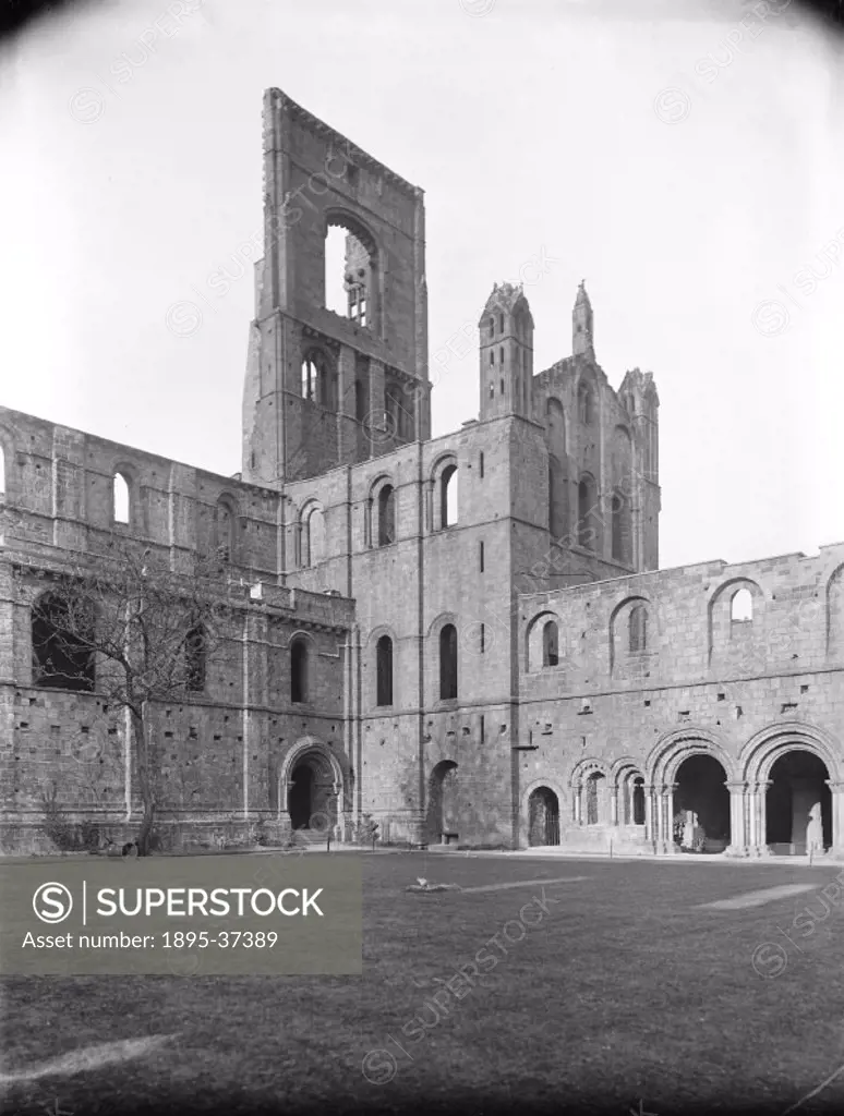 Inside Kirkstall Abbey, Leeds, about 1900.  This photograph was taken for publicity purposes, to show the places that the railways could take people. ...