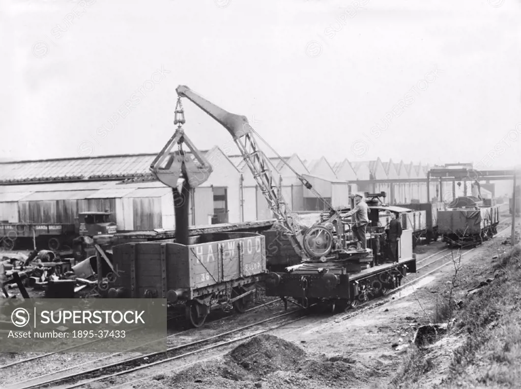 Sentinel crane putting minerals into a wagon, 8 October 1942.  Cranes are an invaluable machine in railway goods depots to lift heavy loads on and off...
