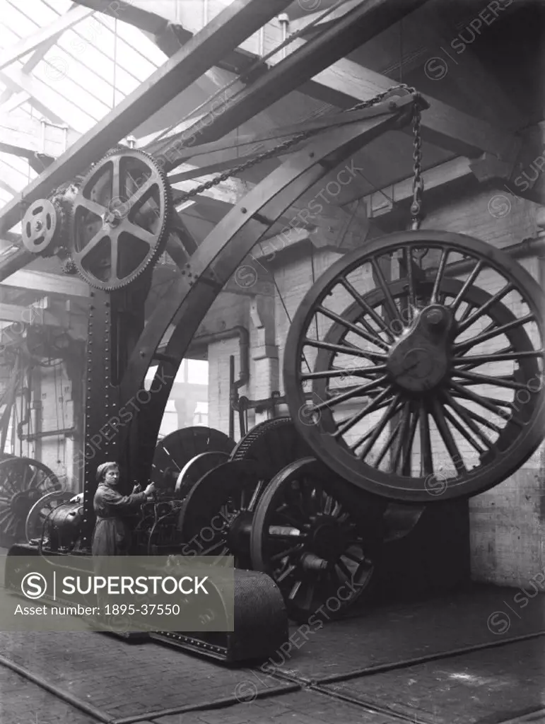 Crane in the wheel shop at Doncaster works, 14 December 1919. The crane is lifting locomotive wheels.  Cranes are an invaluable machine in railway goo...