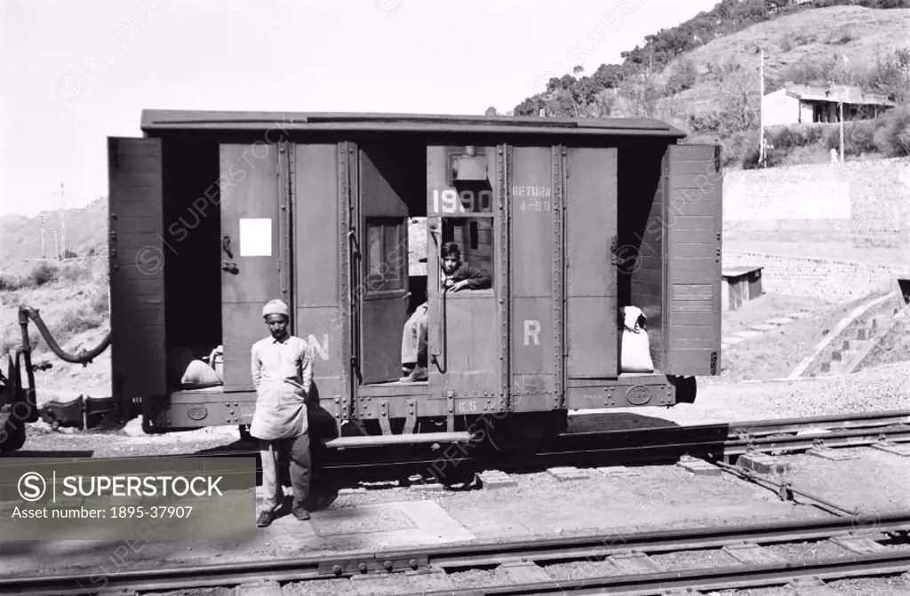 Brake van, on the Northern Indian Railway line from Kalka to Simla, by Peter Bawcutt, 1990.  This train runs on a narrow gauge railway. To cope with I...