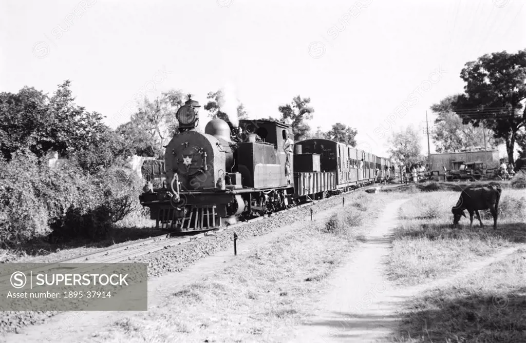 Class W locomotive number 597 with a mixed train at Nadiad, India, by Peter Bawcutt, 1969. This train runs on the Western Railway, between Nadiad and ...