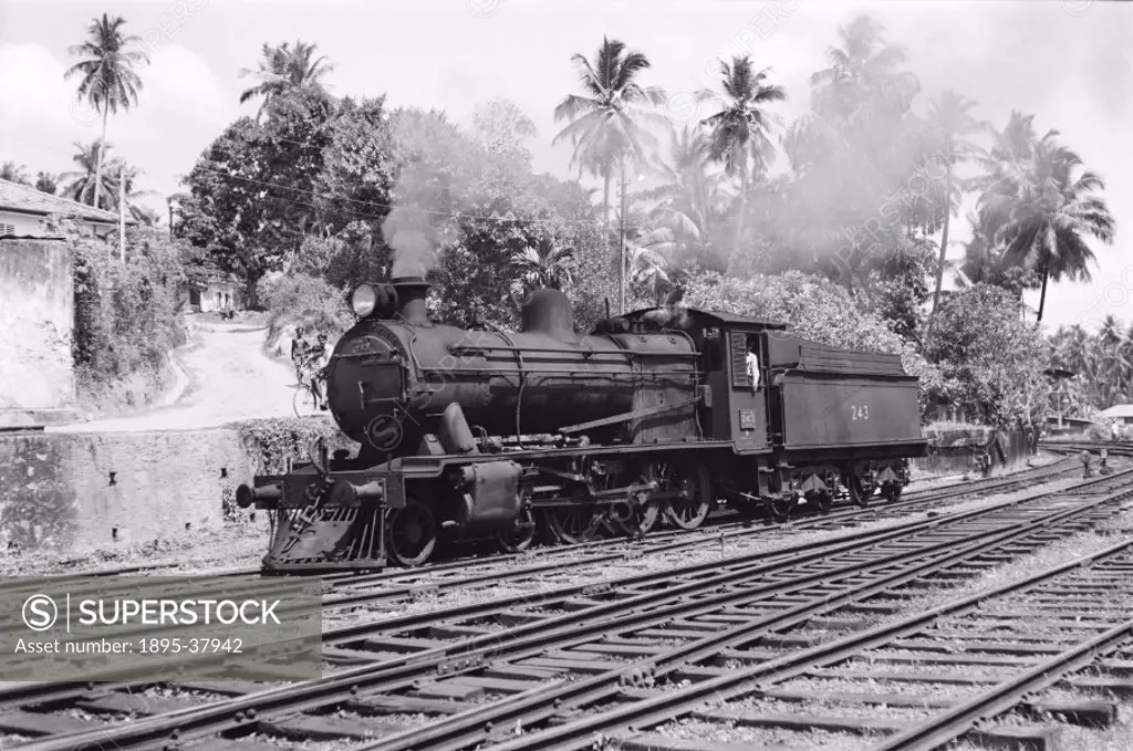 B1 class 4-6-0 locomotive number 243 at Galle, Sri Lanka, by Peter Bawcutt, 1974.   Most of Sri Lanka´s railways were broad gauge (5´ 6´). They were b...