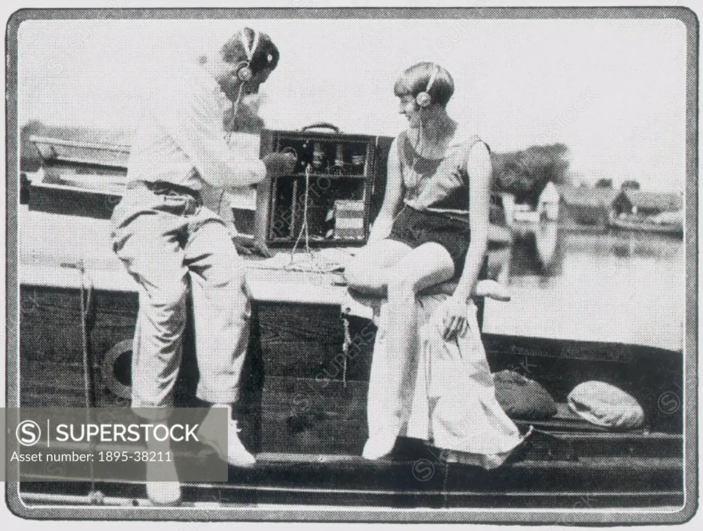 Couple listening the the radio, c 1930s.