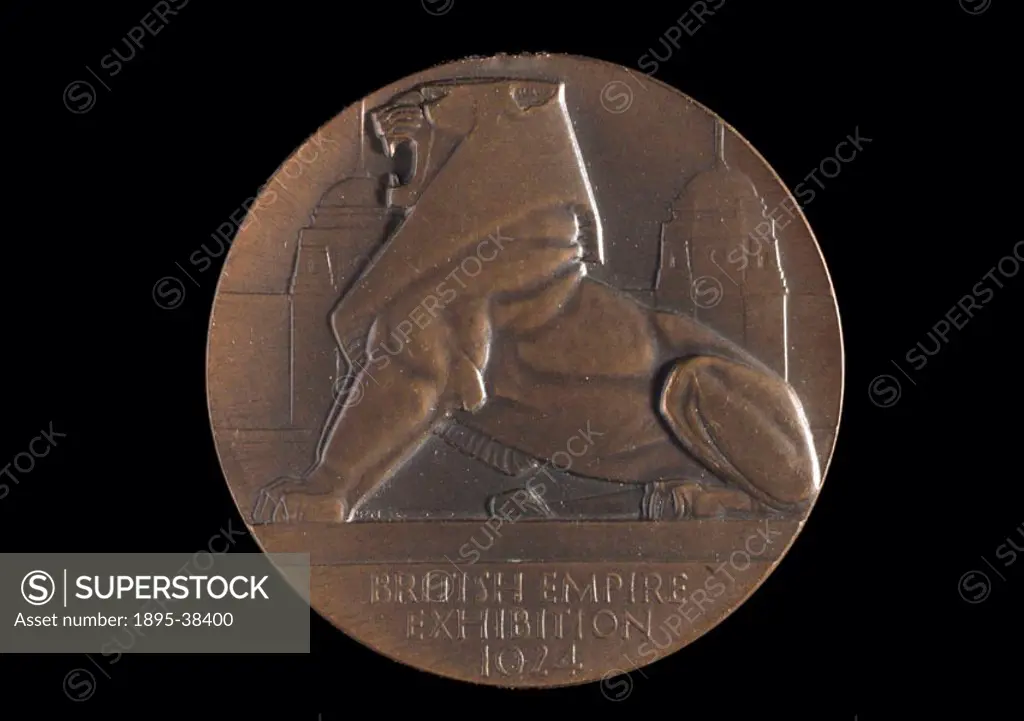 Medal awarded to Ludwig and Henry Oertling for their chemical balances. Design shows relief of a lion roaring in front of Wembley Stadiums twin tower...