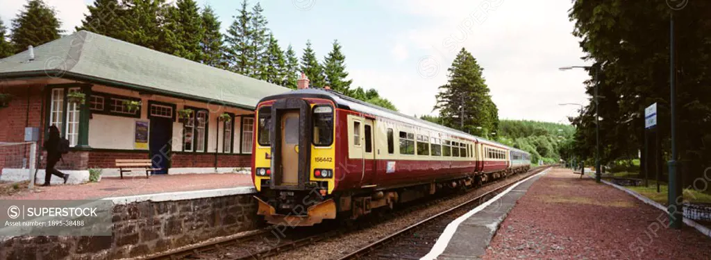 Strathclyde Passenger Transport train at Tulloch Station, Scottish Highlands, by Chris Hogg, July 2000. The train is taking passengers to Glasgow.  Tu...