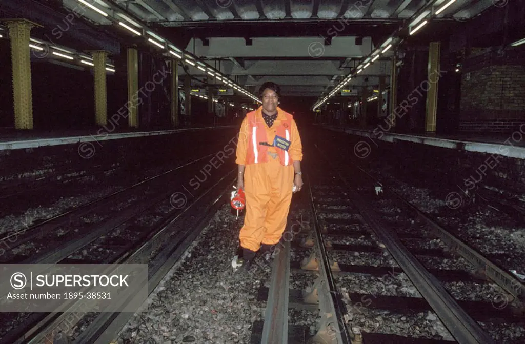 A fluffer’ at work in the London Underground, by Chris Hogg, 1996. Fluffers is the name given to the cleaners in the London Underground. They brush t...
