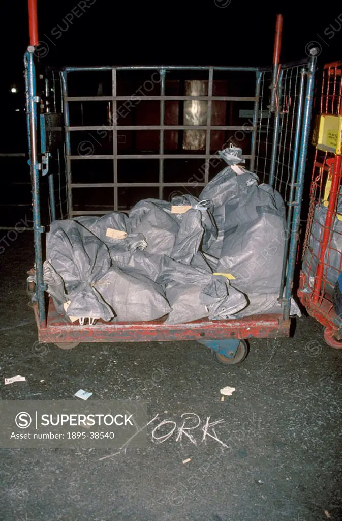 Mail sacks on a station platform, by Chris Hogg, 1997. Post Office trains had been used since the coming of the railways. The letters were often sorte...