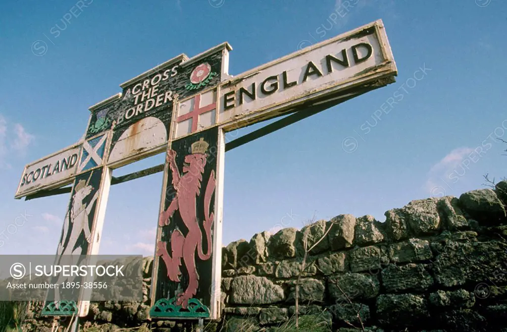 Sign marking the border between England and Scotland, by Lynn Patrick, 1999. The sign shows the flags and crests of each country.  This sign is on the...