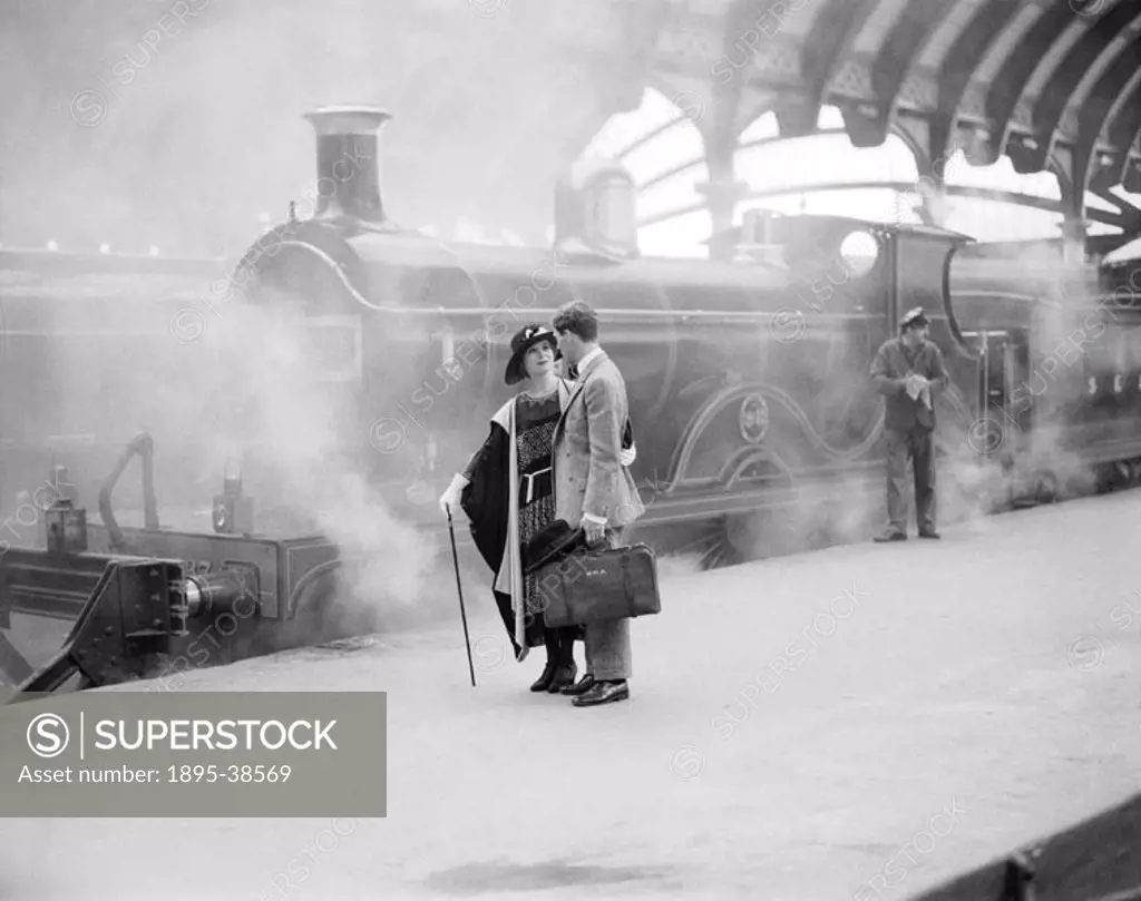 This scene was shot at York Station and the locomotive in the background is a South Eastern & Chatham Railway 4-4-0 locomotive number 737, which is pa...