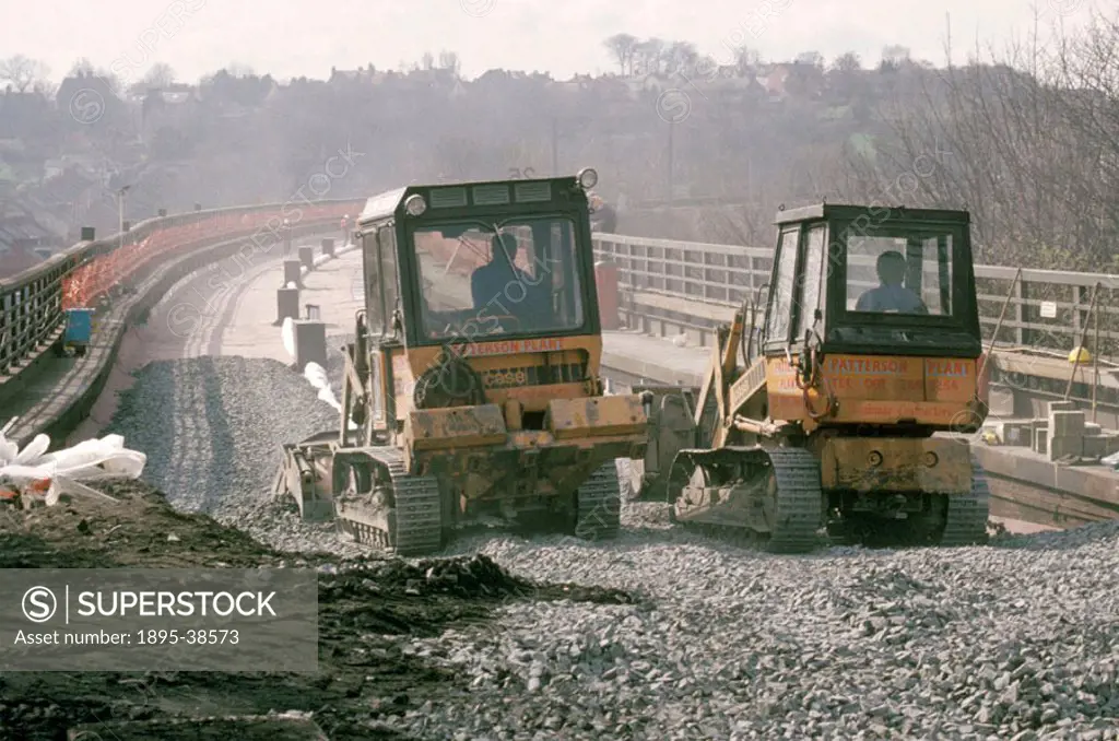 Workers laying ballast on Durham Viaduct, by Chris Hogg, 16 March 1989. Durham is on the East Coast main line which connects London and Edinburgh. It ...
