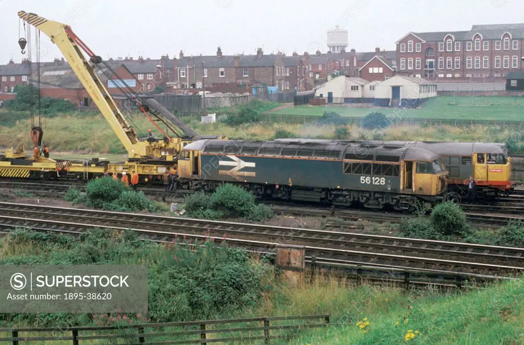 Diesel locomotive number 56128 in York, by Chris Hogg, August 1987. This locomotive, which was pulling a freight train, had been derailed. A breakdown...