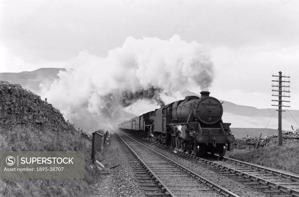 Passenger train, hauled by a class 5 4-6-0 locomotive number 44795 at Aisgill summit, Cumbria, by Eric Treacy, 1955.  This summit, between Garsdale an...