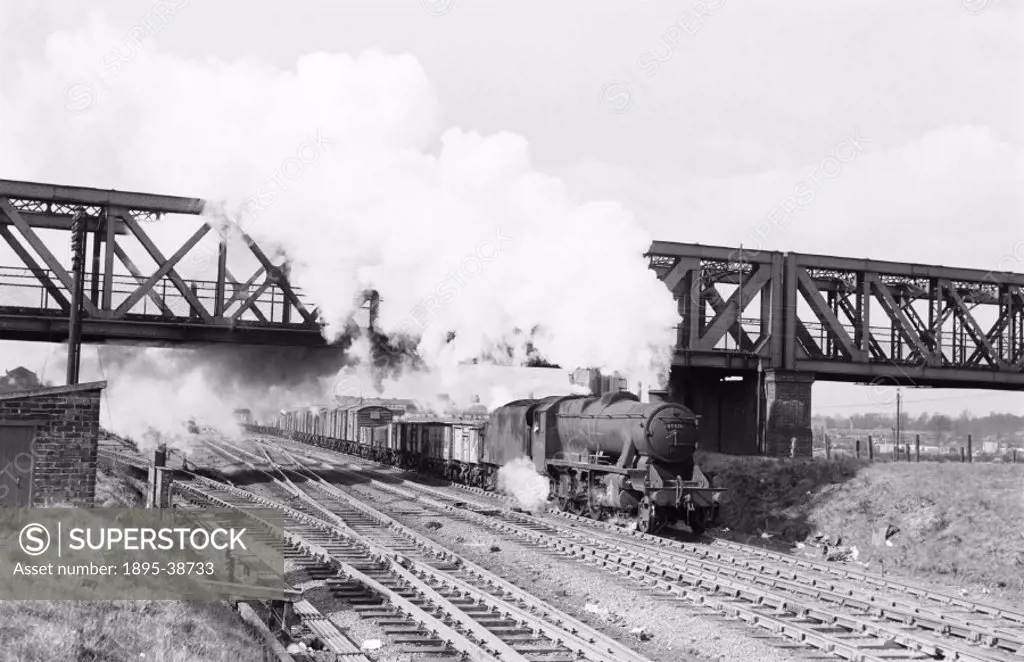 Freight train, pulled by a class 8F 2-8-0 locomotive number 48476 at Rugby, Warwickshire, by J G Click, May 1954.  The coming of the railways meant th...
