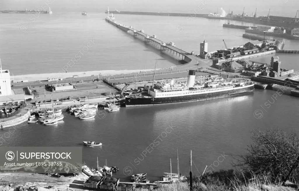 Prince of Wales Pier, Admiralty Pier, Wellington Dock and the SS Canterbury at the port of Dover, Kent, by J G Click, about 1955.  Dover has had a por...