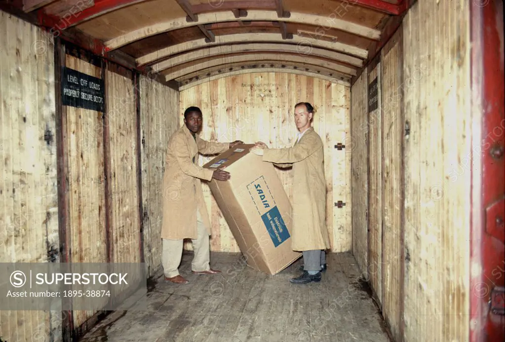 British Railways workers loading freight into a container, 1962.  Improved services, together with the modernisation of equipment meant that more prof...