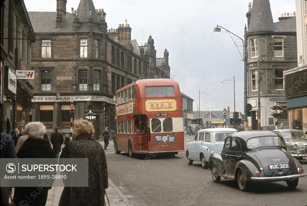 Busy street in Glasgow, 1962.   At this time traffic in towns was building up. By the 1960s it was becoming common for people to travel by car rather ...