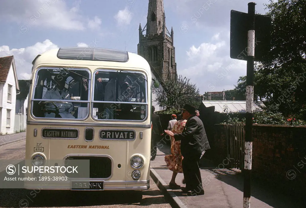 Passengers boarding a bus at Thaxted, Essex, 1963. The passengers have arrived here for a day trip from London, and are taking a bus on an excursion. ...