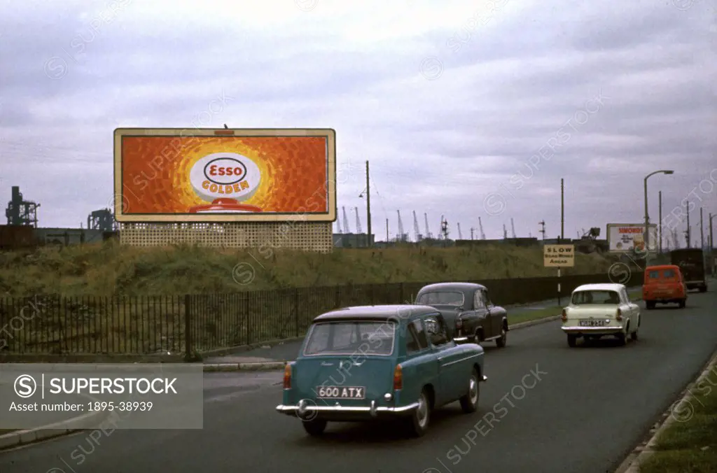 Advert for Esso Petrol in Wales, 1965.   Adverts for car parts and petrol were becoming more common at this time, as road traffic in Britain was build...