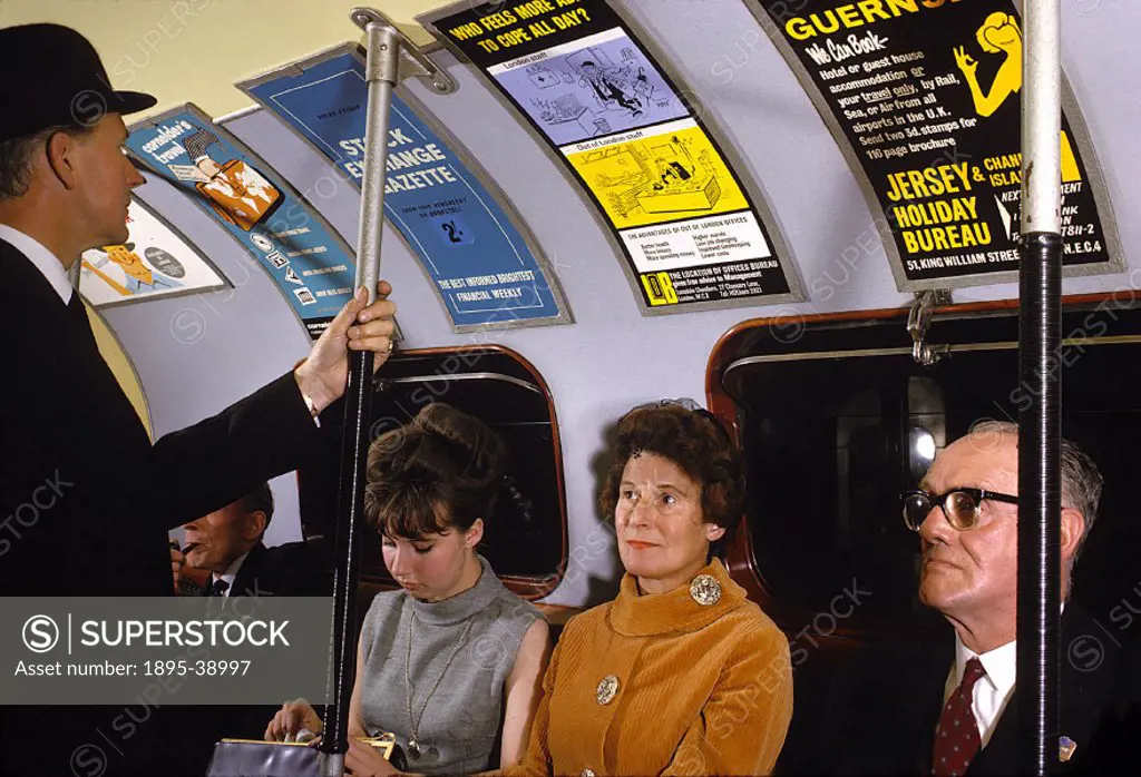 Passengers inside a Waterloo & City Railway train, 1965. This railway is now part of the London Underground.  This photograph was taken to show the ki...