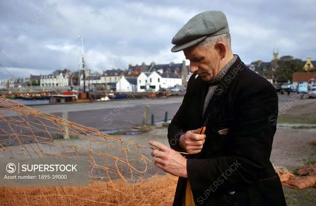 Fisherman mending nets on the Isle of Lewis, 1965.  Scotland had always been a popular holiday destination. People could take a train to the North of ...