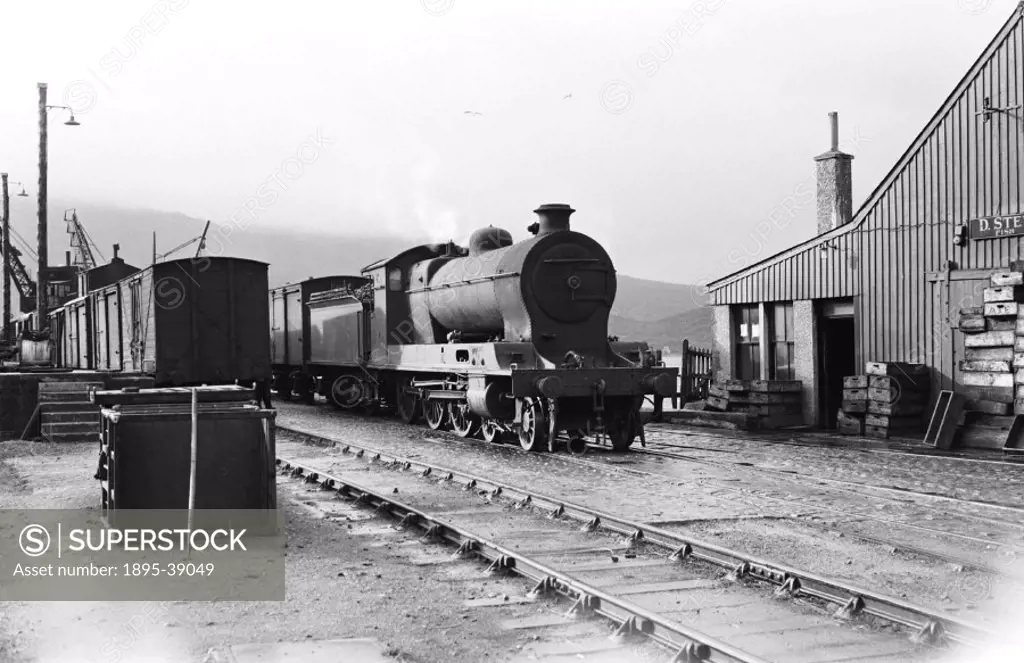 Fish train, hauled by a 4-6-0 locomotive number 54767 ´Clan Mackinnon´ at Kyle of Lochalsh, Scottish Highlands, by Cyril Herbert, 1 October, 1948.  Fi...