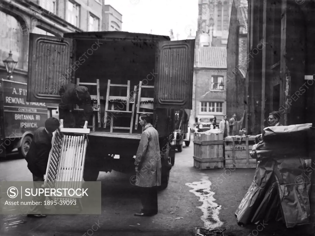 Furniture being loaded into a van at Camden goods yard, London, 1933.  It was common to use the railways when moving house. Furniture was loaded into ...