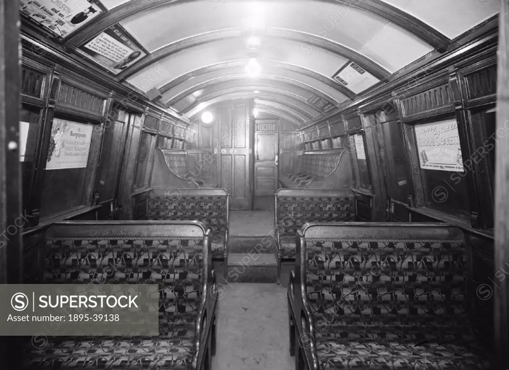 Interior of a carriage on the London Underground, about 1920. The first line on the London Underground, the Metropolitan line, opened in 1863, between...