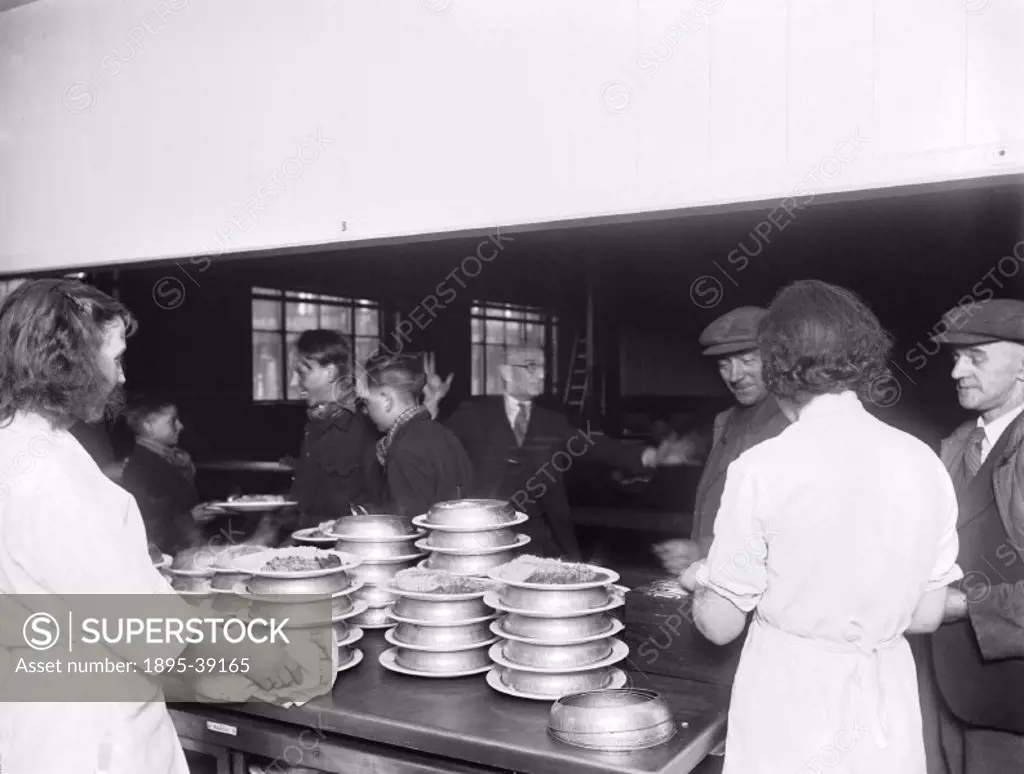 Workers serving food in the canteen at the London & North Eastern Railway´s Shildon works, County Durham, about 1945.  The canteen seated over 1,000 p...