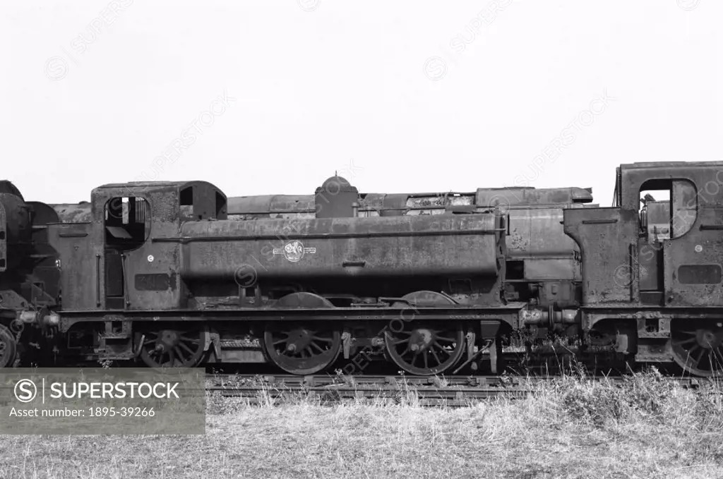 Locomotive in a scrap yard, by Selwyn Pearce-Higgins, 1972.  Steam locomotives were withdrawn from British Railways in 1968. Some locomotives were pre...