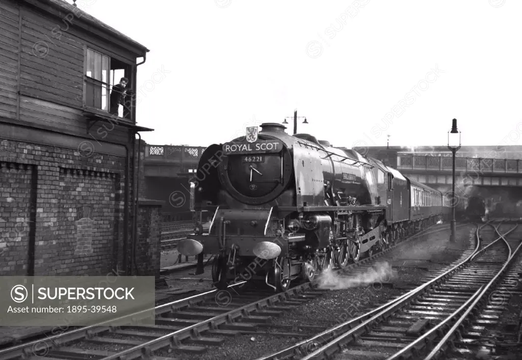 The ´Royal Scot´ train, hauled by a Coronation class 4-6-2 locomotive number 46221 ´Queen Elizabeth´ at Carlisle, Cumbria, by Eric Treacy, 1956.  The ...