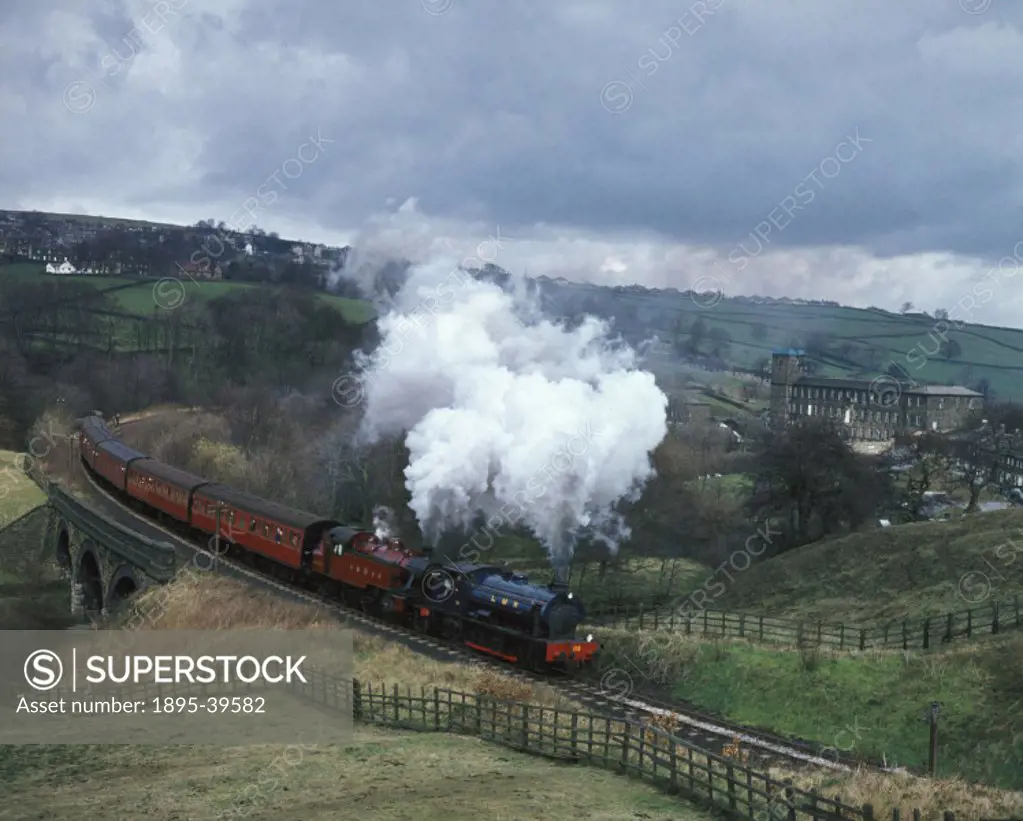 Double headed passenger train, on the Keighley & Worth Valley Railway, West Yorkshire, by Eric Treacy, about 1974.  The line was opened in 1867 by loc...