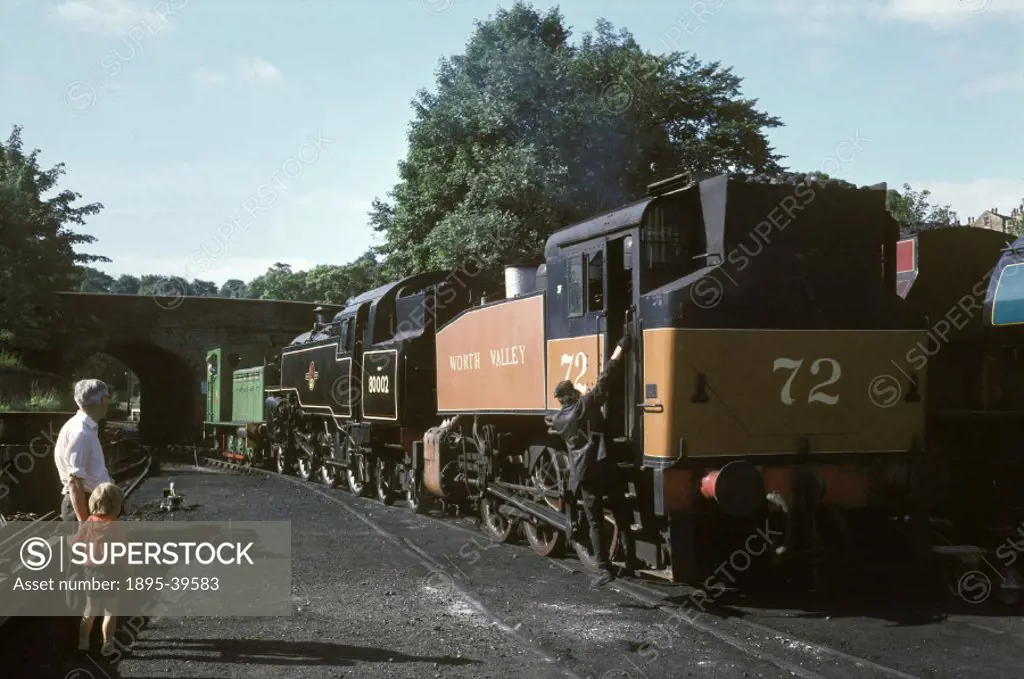 Keighley & Worth Valley Railway locomotives in a shed at Keighley, West Yorkshire, by Eric Treacy, about 1974. The photograph shows Worth Valley locom...