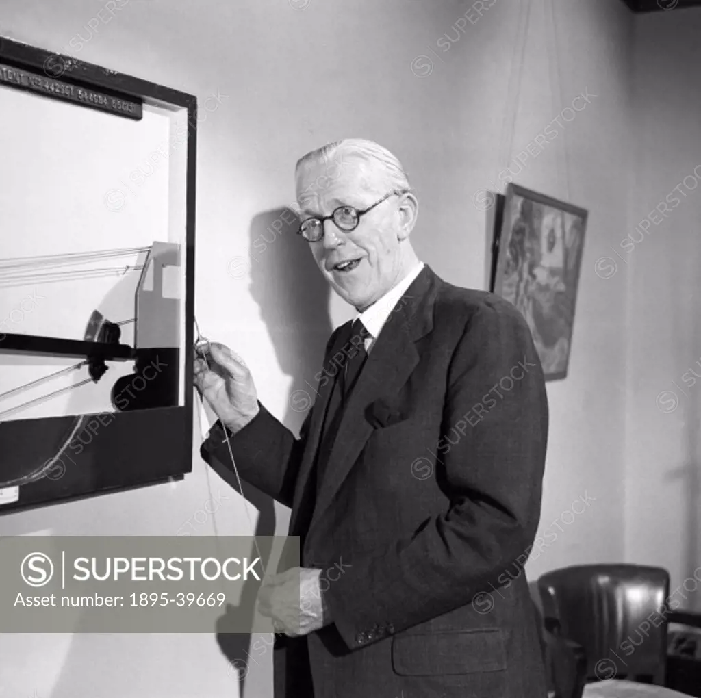 Man giving a presentation at a showroom in Hull, 1949. The presentation is about British Railways.  The railways of Britain were nationalised in Janua...