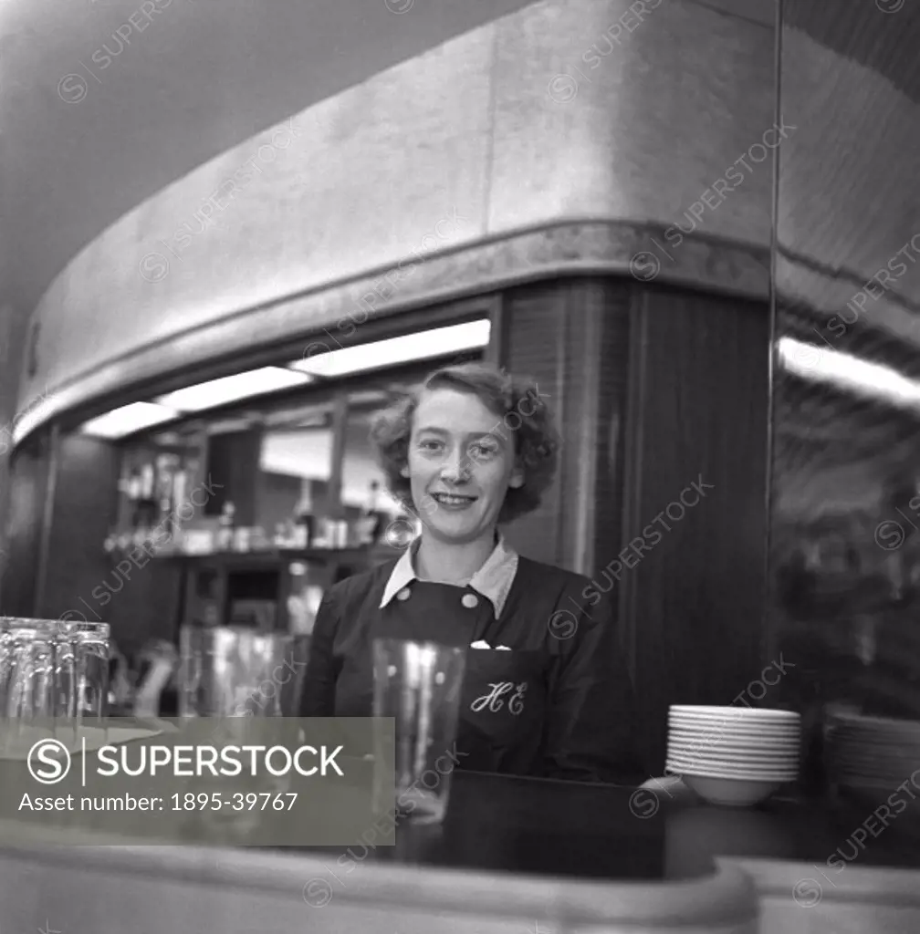 Lady serving in a canteen at Ocean Terminal, Southampton, 1950.  This terminal is where people arrived to take ocean liners to the USA. At this time B...