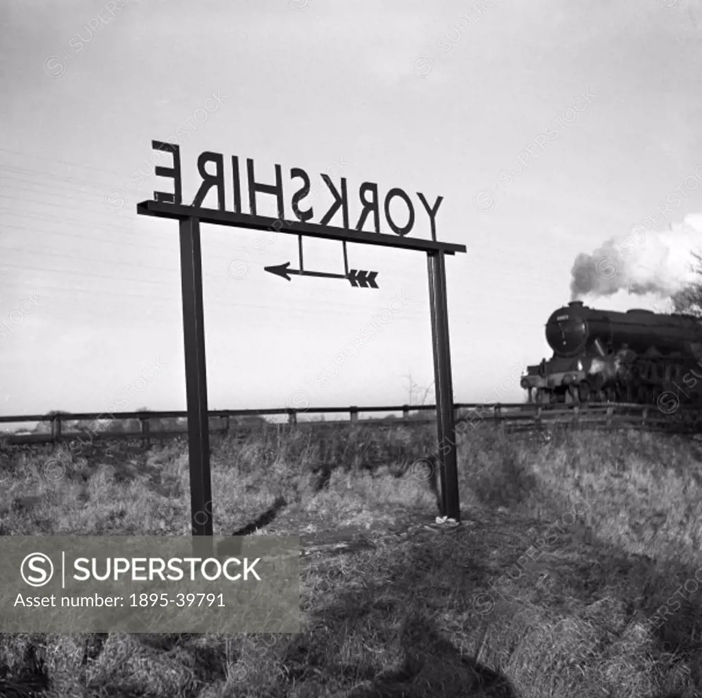 Passenger train, hauled by a 4-6-0 locomotive at Dalton Bank, North Yorkshire, 1951. This location is being filmed.  British Transport films made film...