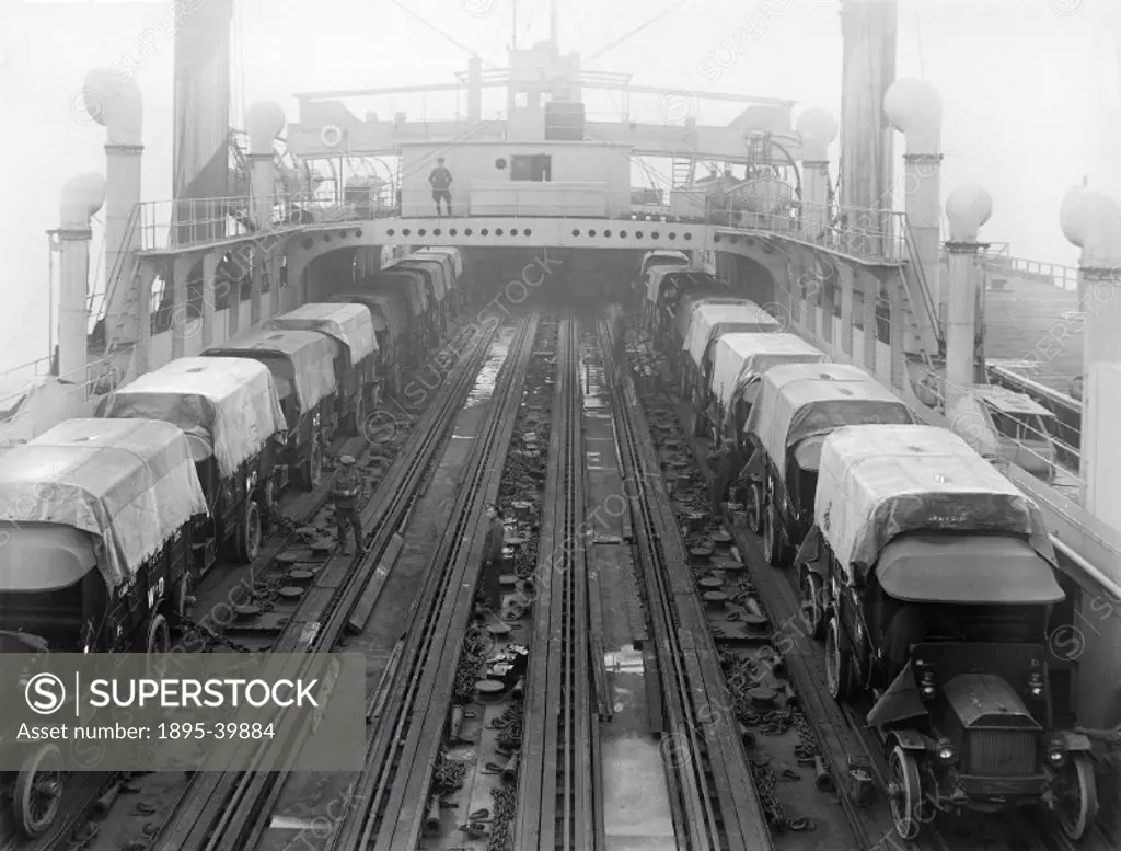 Cars being loaded onto a ferry at Southampton, 11 April 1918. The cars are being loaded onto the ferry to be used in France or Belgium as First World ...
