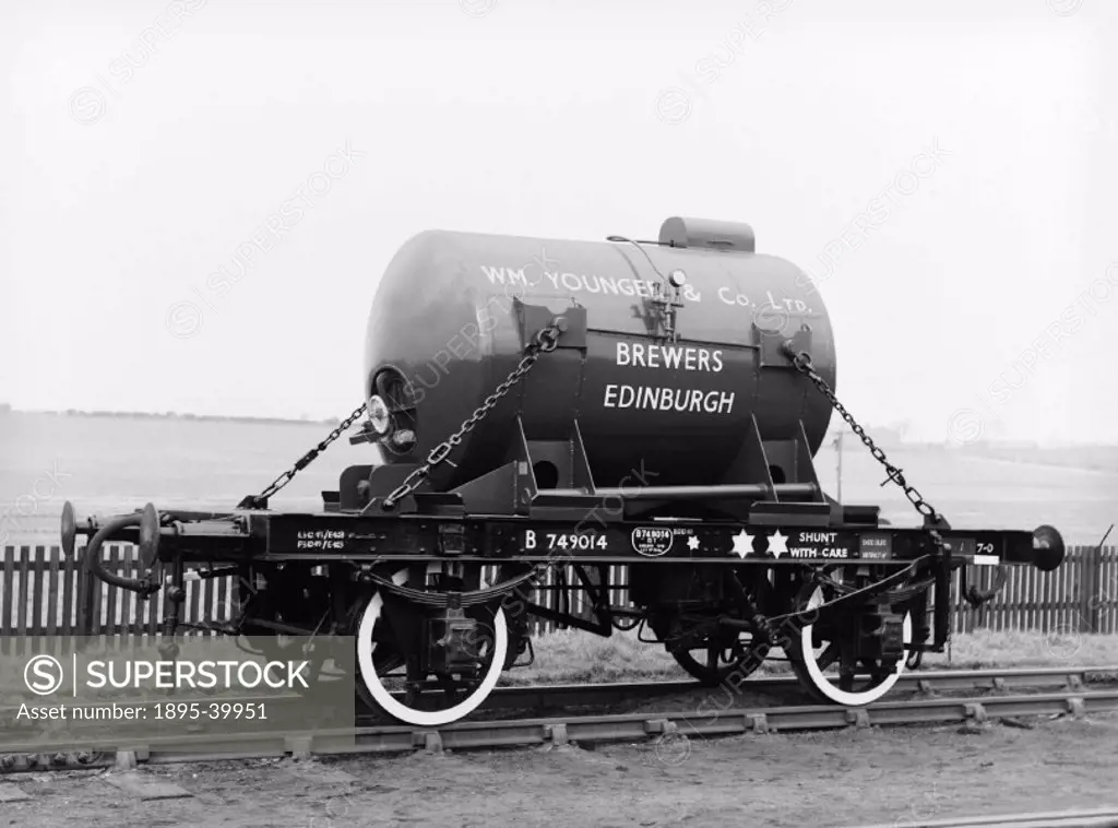 13 ton flat wagon no. B749014, carrying William Youngers and Co Ltd´s beer tanker at Shildon works, about 1952. This wagon was built in 1949. Beer was...