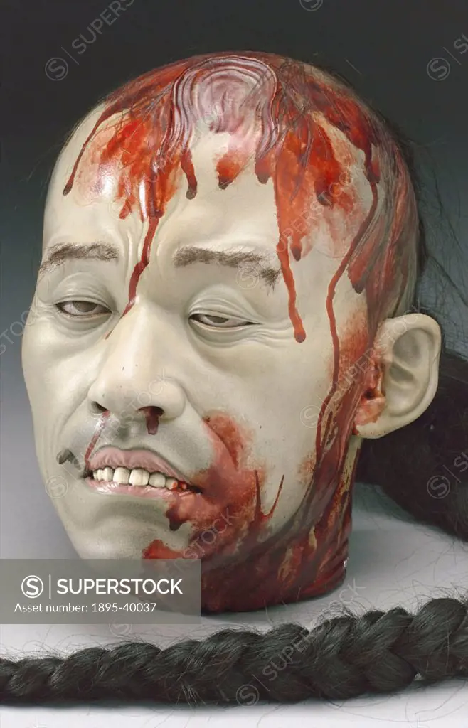 Painted plaster model of the head of an executed Chinese criminal, possibly a Yangstze river pirate. Made in England.